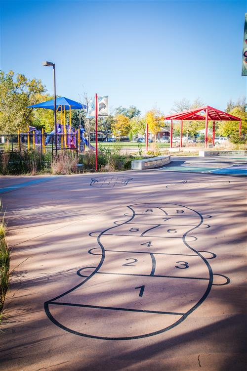 Playground area with hop-scotch painted on ground 